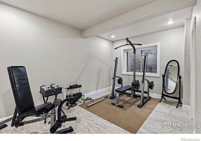 exercise room featuring hardwood / wood-style floors