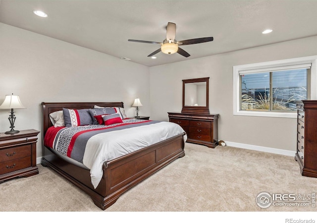 carpeted bedroom featuring ceiling fan