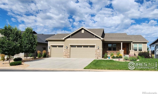 view of front of house featuring a porch and a garage