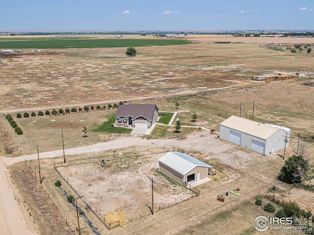 birds eye view of property featuring a rural view