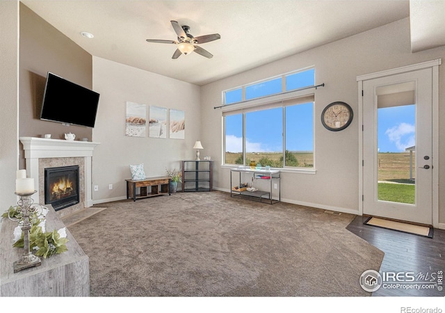 interior space featuring dark wood-type flooring and ceiling fan