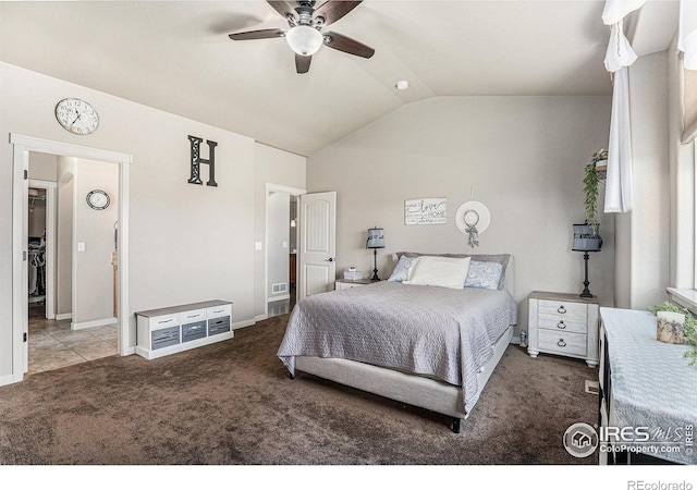 carpeted bedroom featuring lofted ceiling and ceiling fan