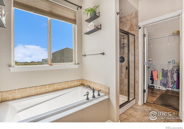 bathroom with independent shower and bath