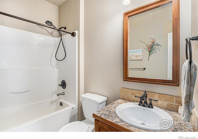 full bathroom with washtub / shower combination, vanity, and toilet