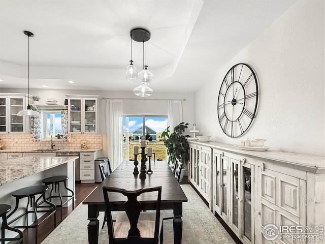 dining space featuring plenty of natural light and sink