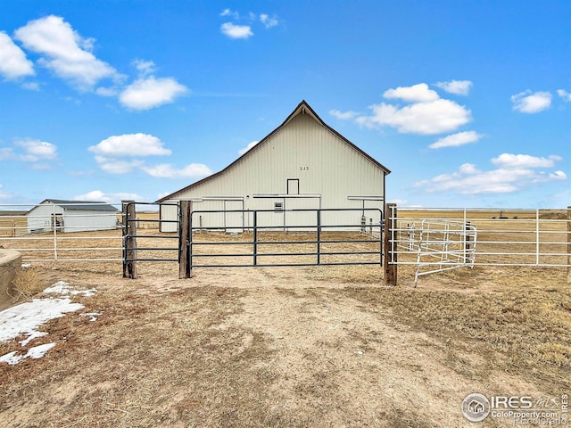 view of outbuilding with a rural view