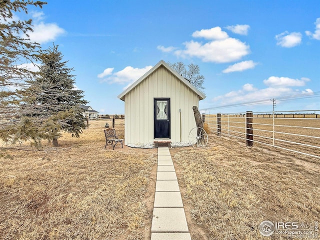 view of outbuilding with a yard