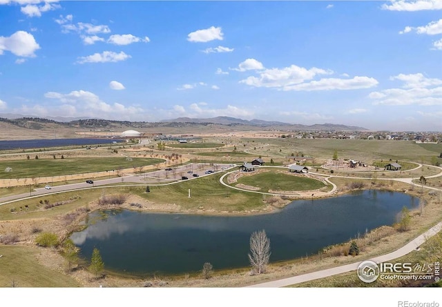 birds eye view of property featuring a rural view and a water and mountain view