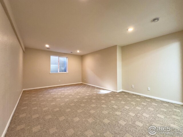 unfurnished room featuring carpet flooring