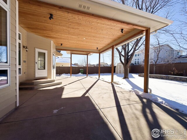 view of patio / terrace featuring a storage shed