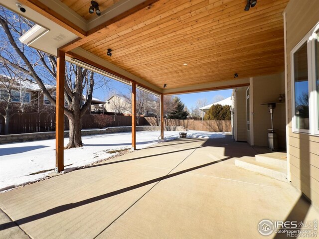 view of snow covered patio