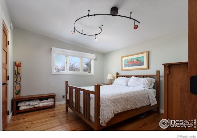 bedroom with light hardwood / wood-style flooring