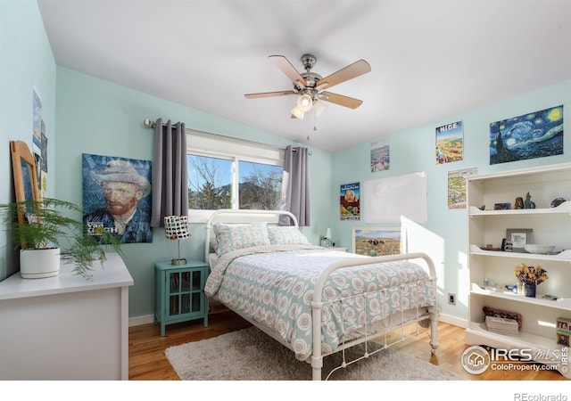 bedroom featuring light hardwood / wood-style flooring and ceiling fan