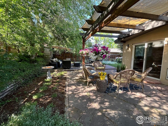 view of patio featuring an outdoor hangout area and a pergola