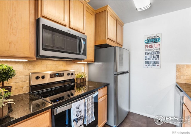 kitchen with light brown cabinetry, decorative backsplash, and stainless steel appliances