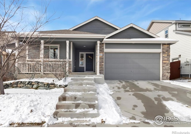 view of front of home featuring a garage and a porch