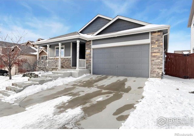 view of front of property with a garage and covered porch