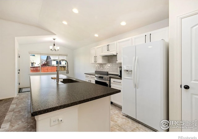 1484 First Light Dr, Windsor, CO 80550 - kitchen featuring white refrigerator with ice dispenser, under cabinet range hood, lofted ceiling, dark countertops, and white cabinetry