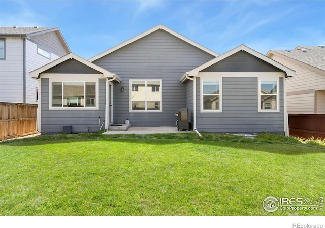 1484 First Light Dr, Windsor, CO 80550 - rear view of house with a patio