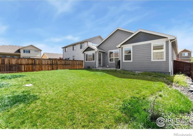 1484 First Light Dr, Windsor, CO 80550 - back of property featuring a fenced backyard