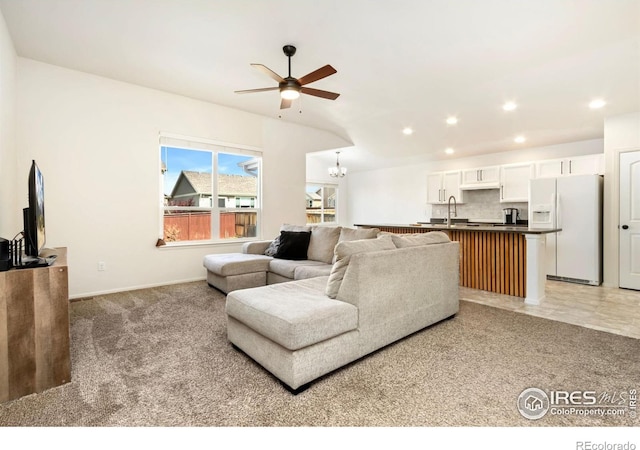 1484 First Light Dr, Windsor, CO 80550 - living area featuring a ceiling fan, recessed lighting, a chandelier, and light carpet