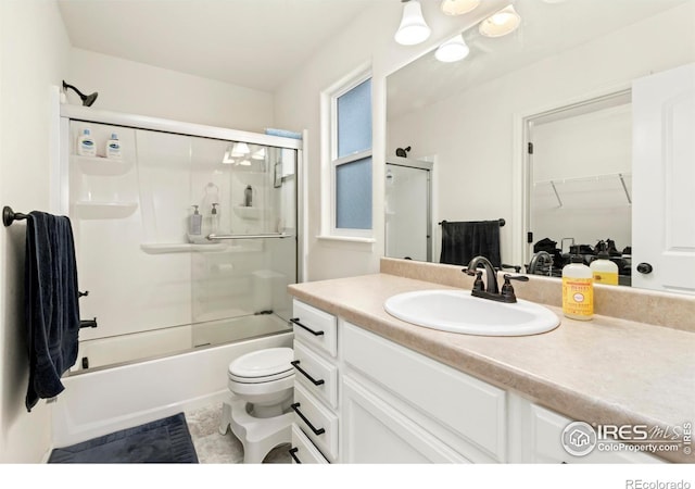 1484 First Light Dr, Windsor, CO 80550 - full bath with vanity, enclosed tub / shower combo, and a walk in closet