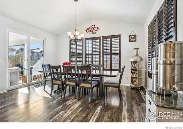 dining area with dark hardwood / wood-style flooring, vaulted ceiling, and a notable chandelier