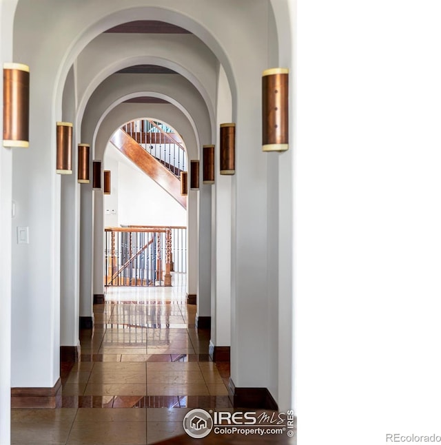 corridor with dark tile patterned floors