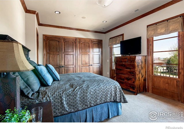 bedroom with crown molding and light colored carpet