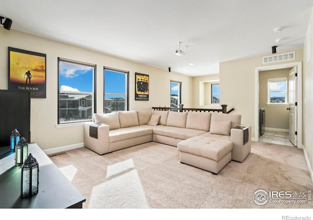 living room featuring light carpet