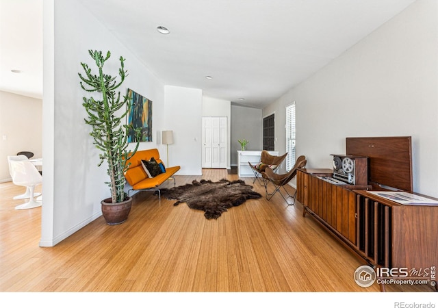 living area with light hardwood / wood-style floors