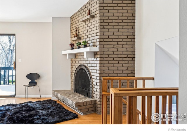 living room with a fireplace and hardwood / wood-style floors