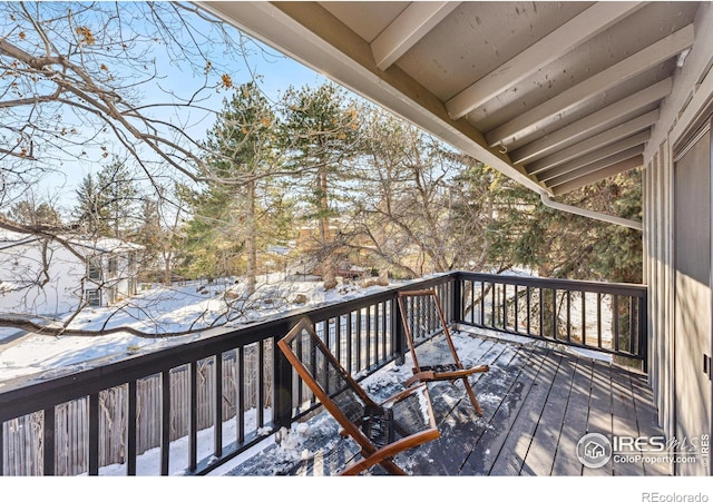 view of snow covered deck