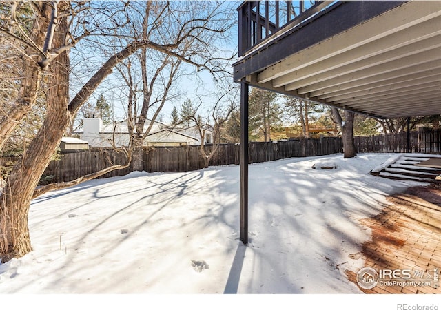 view of yard layered in snow