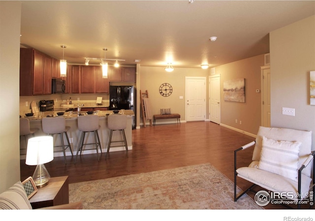 living room with dark hardwood / wood-style floors