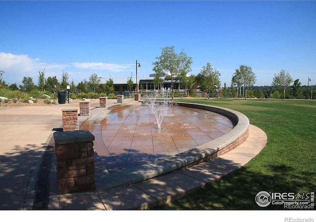 view of home's community featuring a lawn