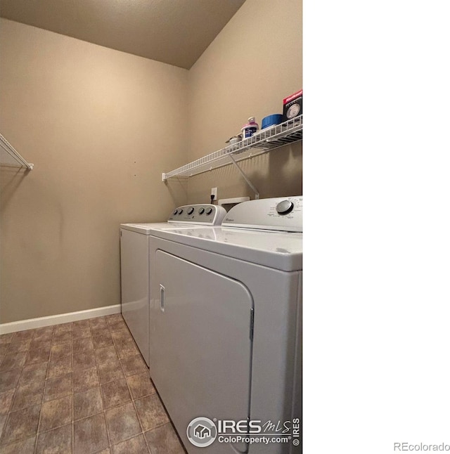 clothes washing area with independent washer and dryer