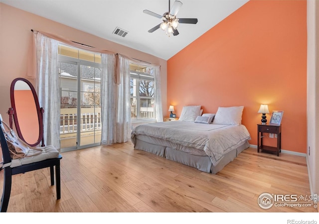 bedroom with lofted ceiling, access to exterior, light hardwood / wood-style floors, and ceiling fan