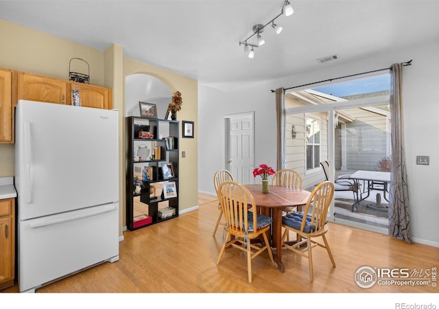 dining space featuring light hardwood / wood-style floors