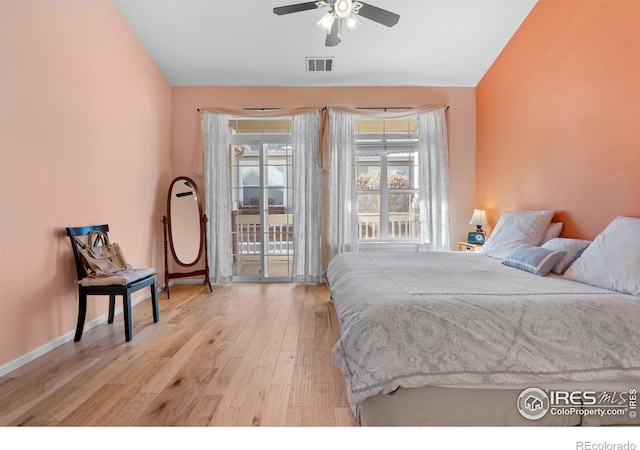 bedroom with ceiling fan, access to exterior, and light hardwood / wood-style flooring