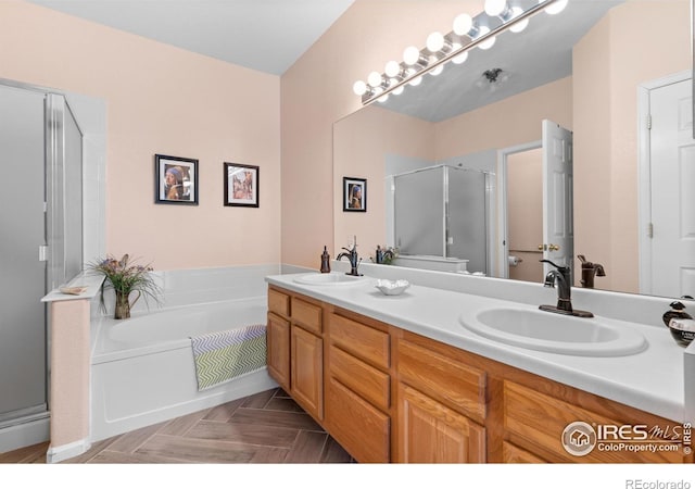 bathroom featuring vanity, parquet flooring, and separate shower and tub