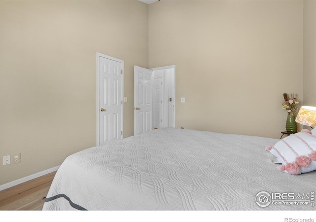 bedroom with light wood-type flooring