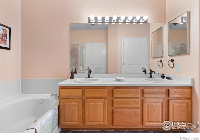 bathroom featuring vanity and separate shower and tub