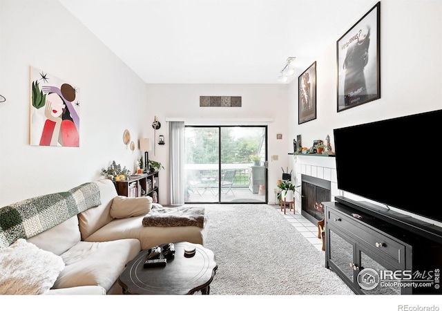 living room featuring track lighting and light tile patterned floors