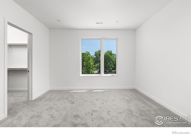 unfurnished bedroom featuring light colored carpet