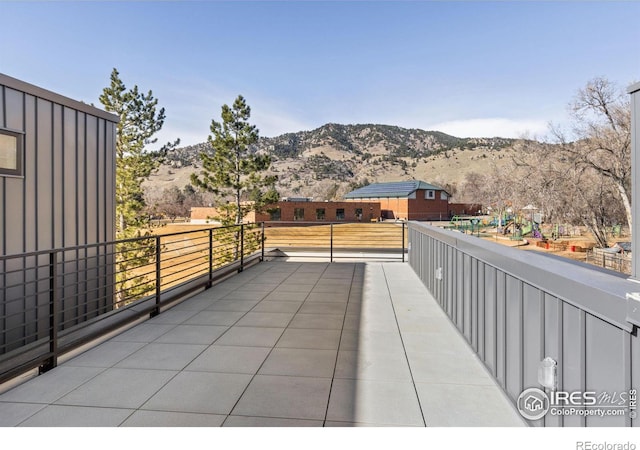 view of patio / terrace featuring a mountain view