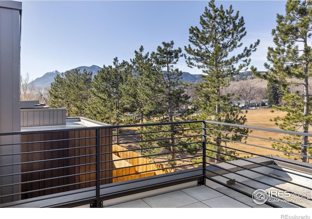 balcony featuring a mountain view