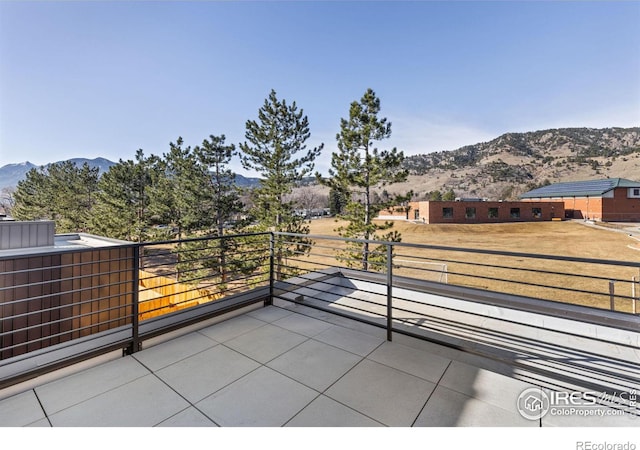 view of patio / terrace featuring a balcony and a mountain view