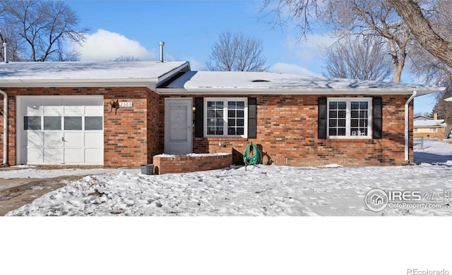 ranch-style home featuring a garage