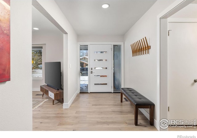 entryway featuring light wood finished floors, baseboards, and recessed lighting